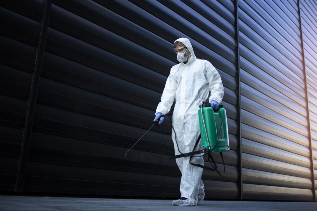 person-white-chemical-protection-suit-doing-disinfection-public-areas-stop-spreading-highly-contagious-corona-virus-min