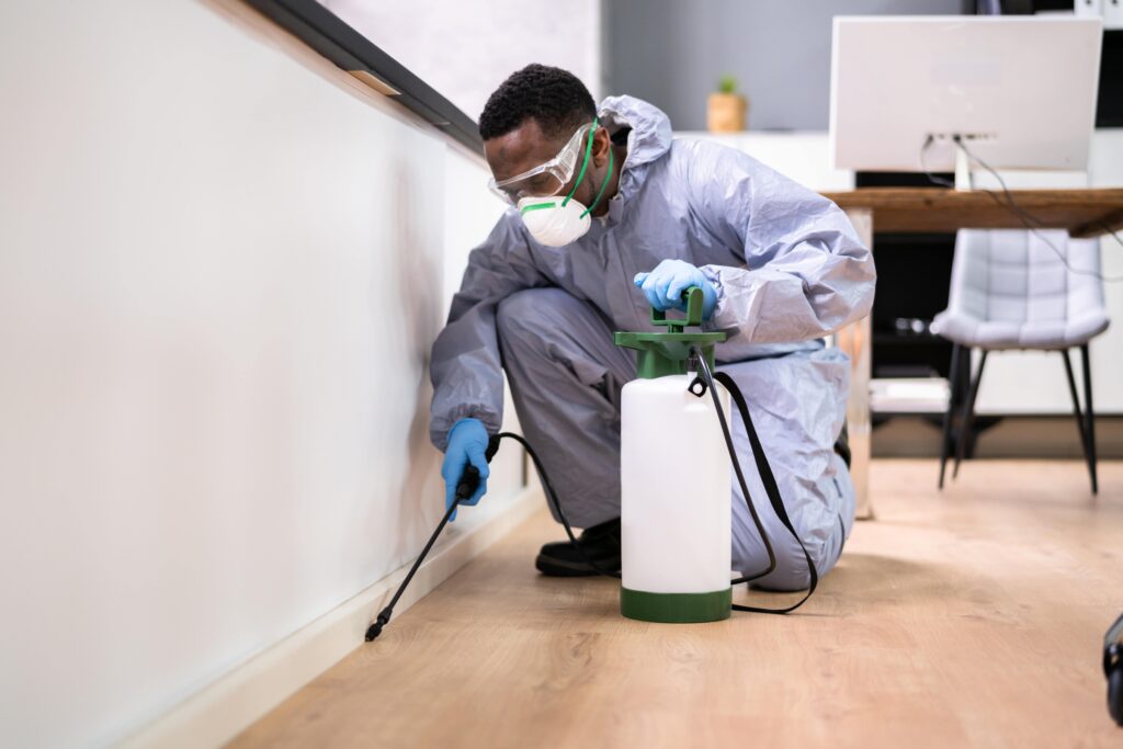 pest-control-exterminator-man-spraying-termite-pesticide-min